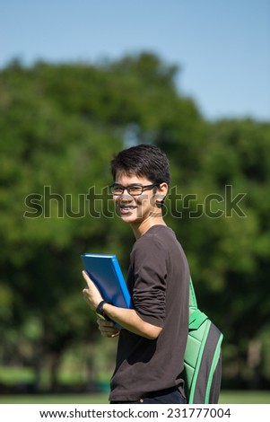 asian student in the park with book and lecture note Bangkok Thailand