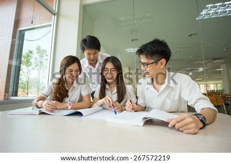 Asian students in library of university