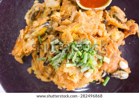 delicious Thai noodles shrimp with fry oyster shell, which is the popular food in Thailand