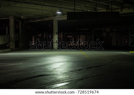 A mall parking garage at night.