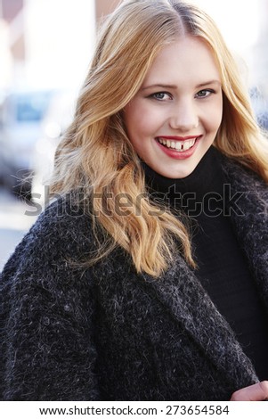 Portrait of beautiful strawberry blonde woman, smiling