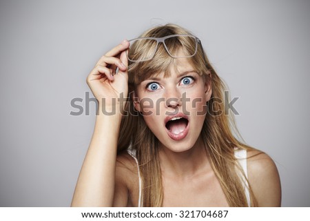 Wide eyed young student in shock, portrait