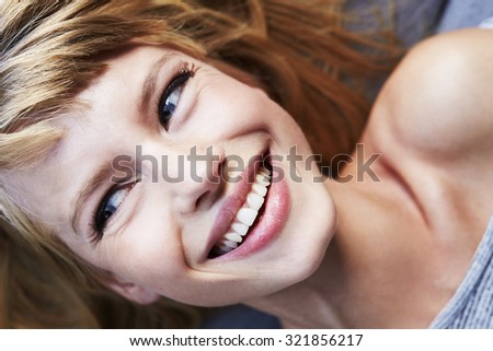Close up of laughing young woman