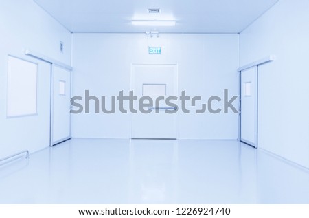 emergency door of science laboratory or industry factory background with bright fluorescent light