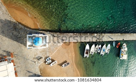 Aerial drone, bird\'s eye view photo of iconic small chapel of Agios Nikolaos in old port of Mykonos, Cyclades, Greece