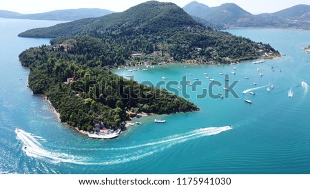 Aerial drone bird\'s eye view photo of iconic port of Nidri or Nydri a safe harbor for sail boats and famous for trips to Meganisi, Skorpios and other Ionian islands, Leflkada island, Ionian, Greece