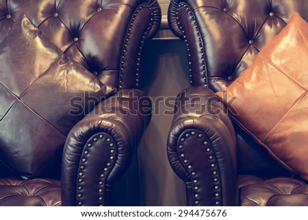 Leather sofa and pillows in retro tone with selective focus on the pillows