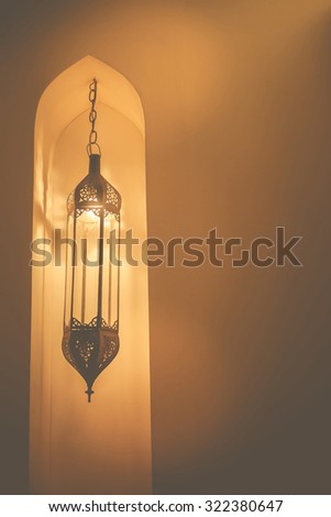 Morocco style lamp inside a moroccan interior room at night.