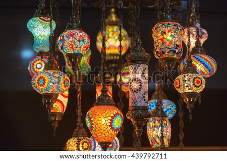 Colorful Moroccan style lanterns lamp hanging down from ceiling.