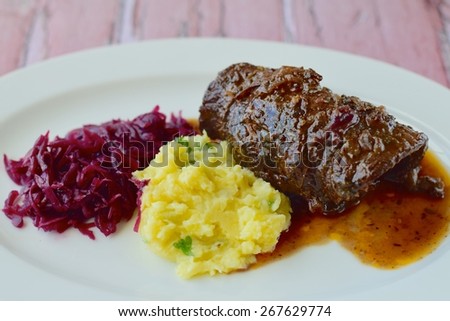 Beef roulade with mashed potato and red cabbage