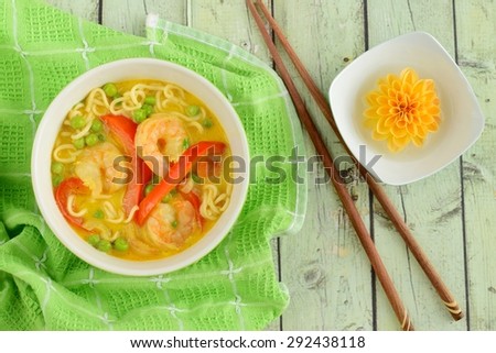Spicy Prawn Noodle Soup with Peas and Bell Pepper in a Bowl