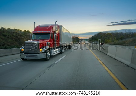 Big red semi truck on highway