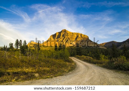 Mountain Road in Fall. Beaver Mines Lake Provincial Recreation area in Castle Wilderness Area. Alberta, Canada