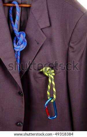 Business suit and climbing equipment