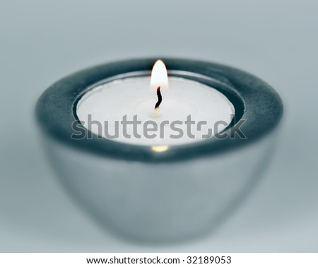 A candle with yellow flame