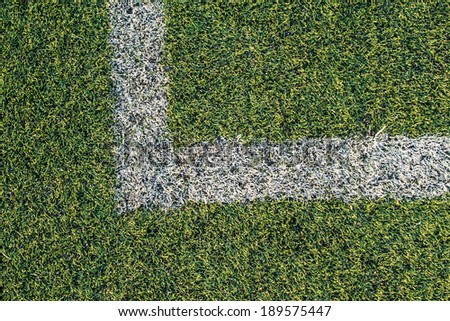 Artificial turf football field green white grid.