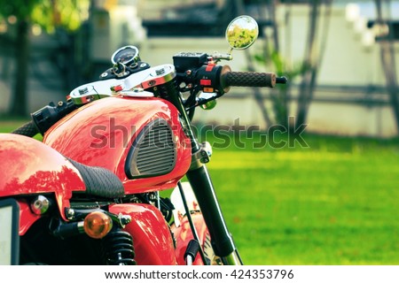vintage motorcycles detail on a green lawn