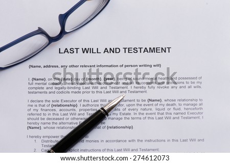 last will and testament  on the white paper with pen
