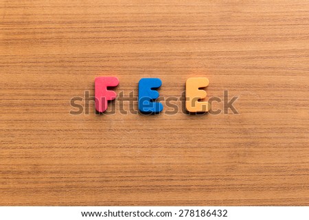 fee  colorful word on the wooden background
