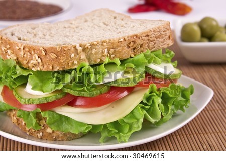 stock-photo-ovo-lacto-vegetarian-sandwich-containing-cheese-lettuce-tomato-egg-and-zucchini-in-a-30469615.jpg