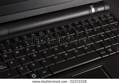 Close up of a black net-book keyboard.