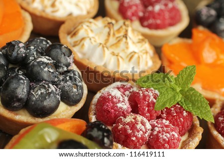 Berries tarts, peach and lemon tarts display