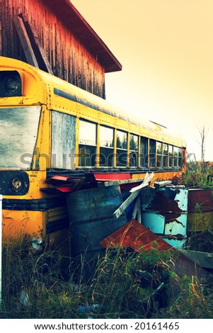 School bus and metal barrels