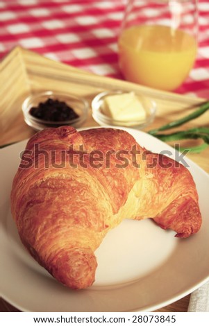 Croissant and juice in a tray