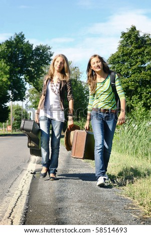 suitcases for girls. stock photo : Two young girls