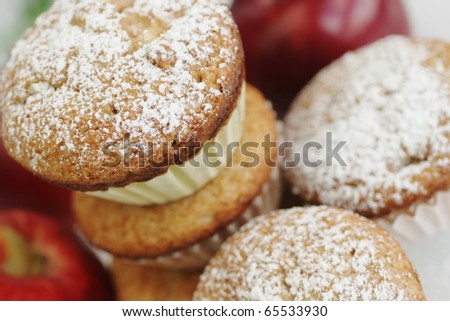 Fresh and hot apple muffins with sugar powder on top