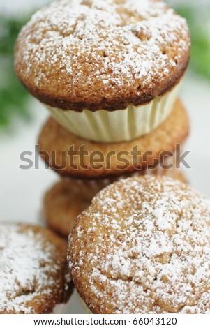 Fresh muffins with sugar powder on top