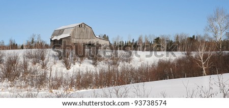 Old barn during a nice winter day in Canada