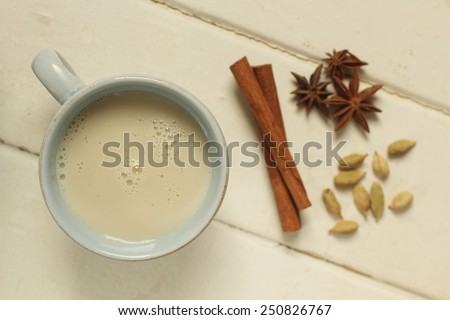 Top view of a chai tea with cinnamon, anise and cardamom