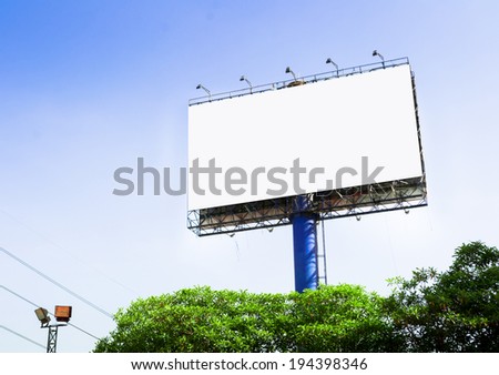 Tall billboards for advertising with blue sky.