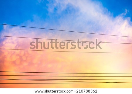 Power line at sunset with colorful cloud