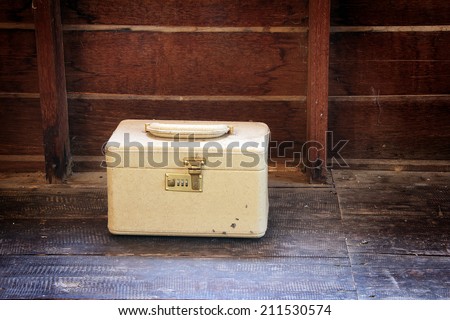 an old vintage cream train case or makeup luggage