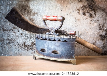 still life of antique iron and old knife