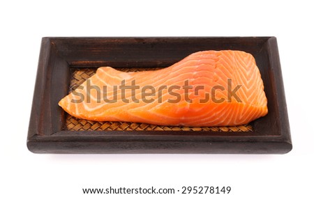 Salmon meat on bamboo tray isolated on white background