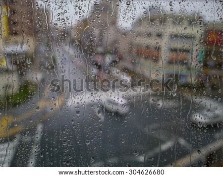 in raining day. A view of road and rural area from the window outside