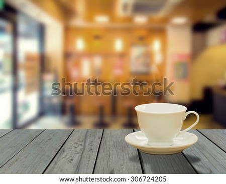 cup of coffee on table in cafe , night light