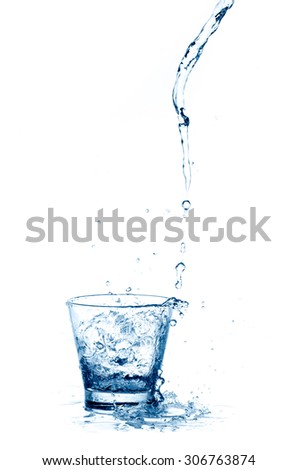 pouring water splash into glass isolated on white background