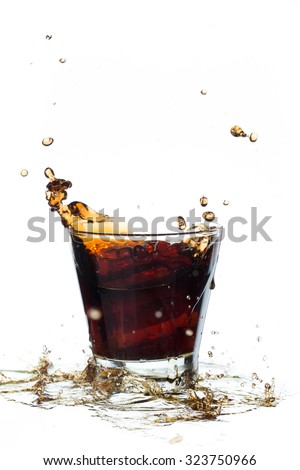 Fresh Coca Cola  with splash isolated on a white background