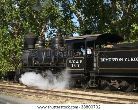 Steam is released in the drive stroke from a restored locomotive done up as an engine of the long defunct (1909) C Y & P Railroad