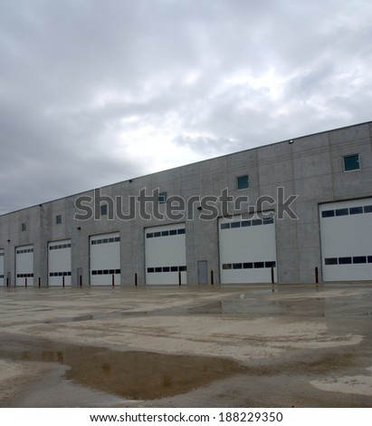 Service bay doors in a newly constructed commercial building made of largely prefabricated materials