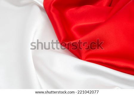 red and white background with a red and white satin