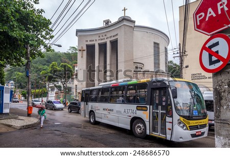 Rio De Janeiro, Brazil - November 28, 2014:The bus passing the street in front of the Church near the train that go to visit Christ The Redeemer.