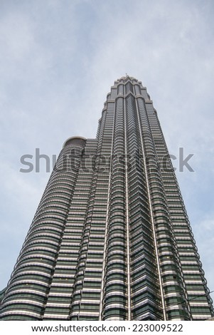 KUALA LUMPUR, MALAYSIA - JANUARY 3 2014: The Petronas twin towers are twin skyscrapers in Kuala Lumpur, the tallest twin towers in the world and the tallest buildings in the world from 1998 to 2004.
