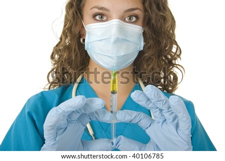 Health Care professional wearing gloves and mask preparing needle