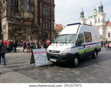 Prague, Czech Republic: May 2014 - Municipal police van with information sign on Old Town Square (Staromestske namesti)