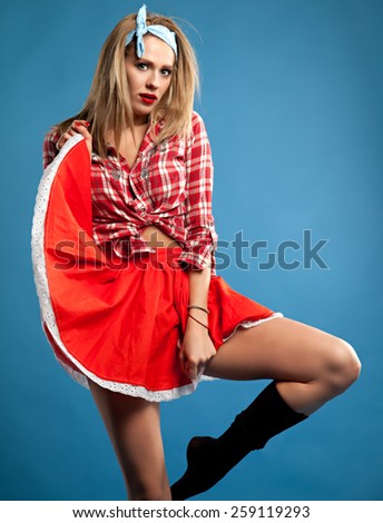 sexy girl hippie in a studio in vintage clothing with retro things.